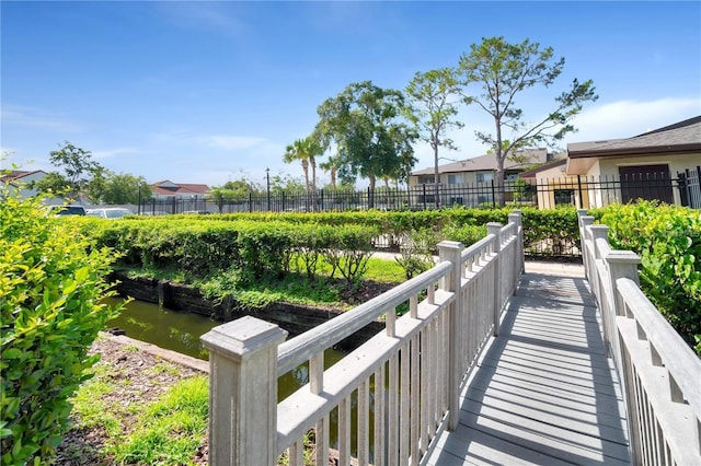 surrounding community featuring a water view