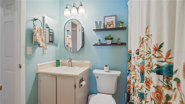 bathroom with vanity and toilet