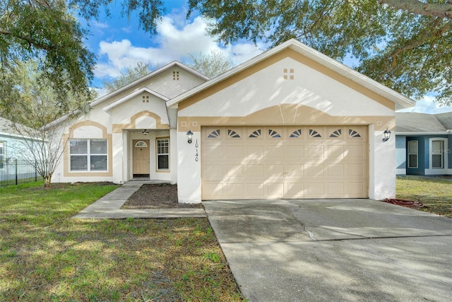 view of front of property featuring a garage and a front lawn