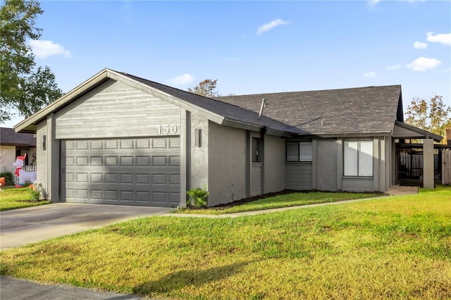 ranch-style home with a front lawn and a garage