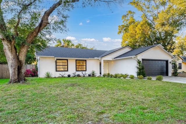 ranch-style house with a garage and a front lawn