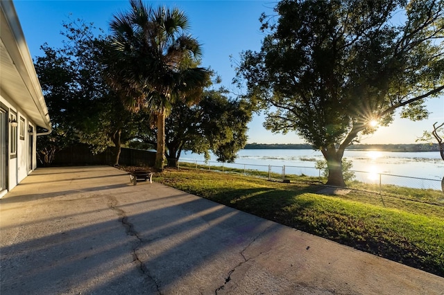 view of yard featuring a patio area and a water view