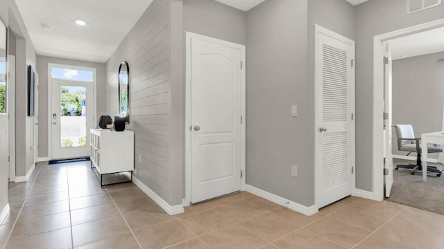 foyer featuring light tile patterned floors