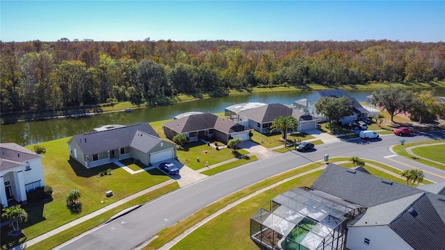 birds eye view of property with a water view