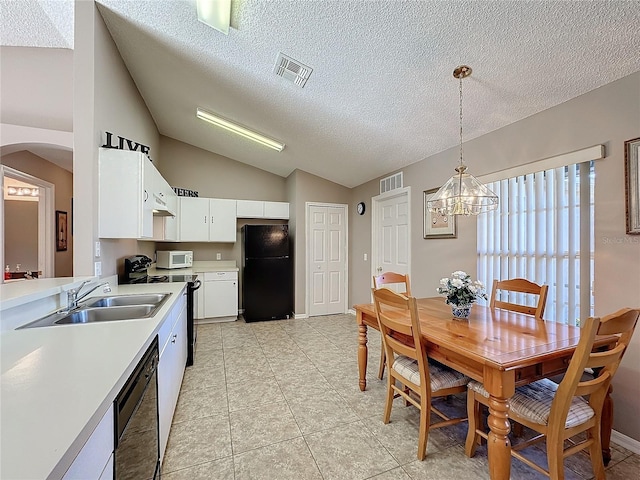 kitchen with sink, hanging light fixtures, a chandelier, white cabinets, and black appliances