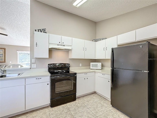 kitchen featuring sink, white cabinets, a textured ceiling, light tile patterned flooring, and black appliances