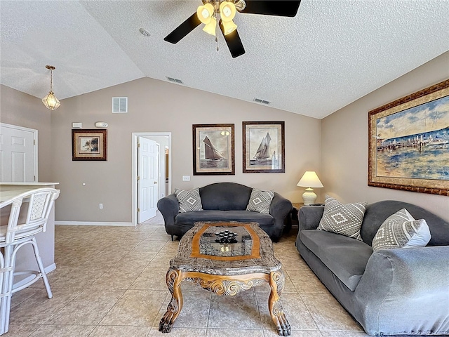 tiled living room with ceiling fan, lofted ceiling, and a textured ceiling