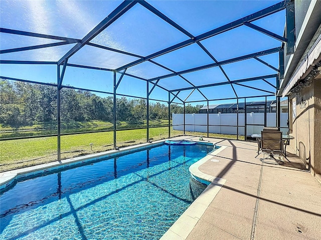 view of pool with a lanai, a patio area, and a yard