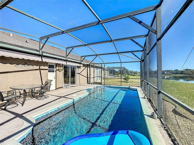 view of swimming pool featuring a water view, glass enclosure, and a patio area