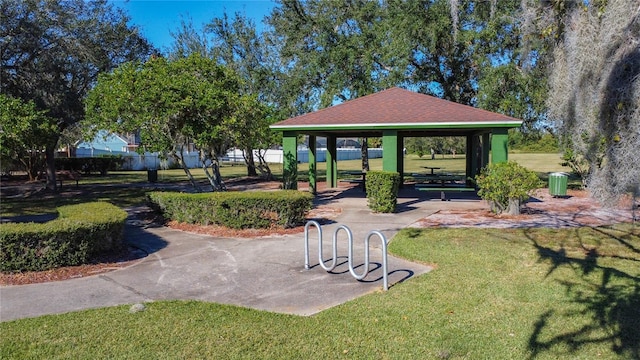 surrounding community featuring a gazebo and a lawn