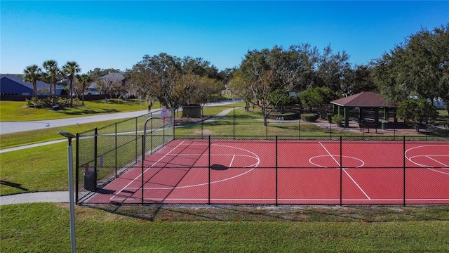 view of basketball court with a gazebo and a lawn