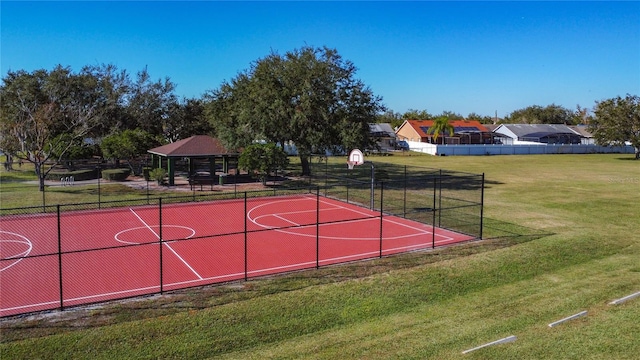 view of basketball court with a gazebo and a lawn