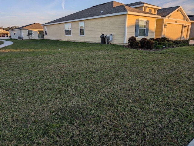 view of side of property featuring a yard