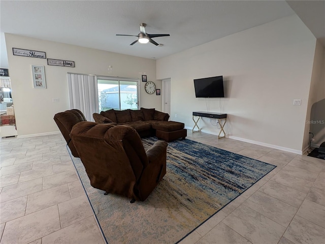 living room featuring ceiling fan and light tile patterned floors