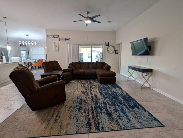 tiled living room with ceiling fan