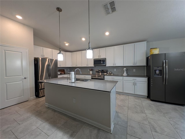 kitchen with stainless steel appliances, white cabinetry, hanging light fixtures, and sink