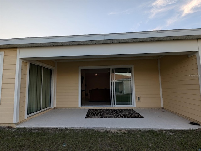 property entrance with a patio area