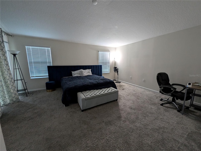 carpeted bedroom featuring a textured ceiling