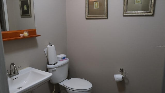 bathroom with toilet and sink