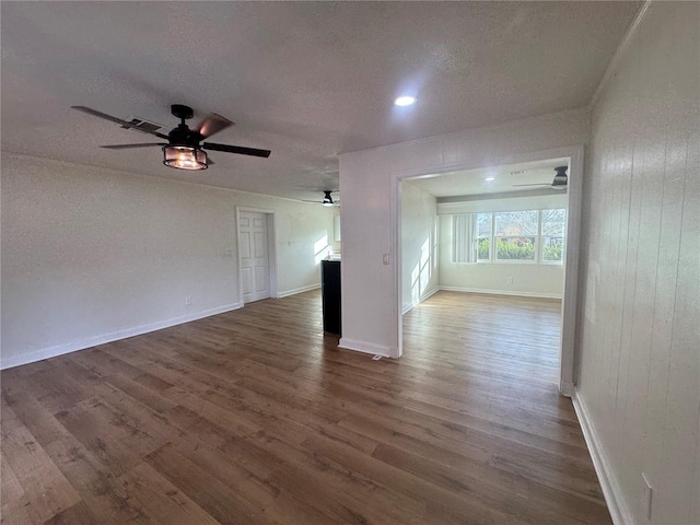 unfurnished living room with wood walls and dark hardwood / wood-style flooring