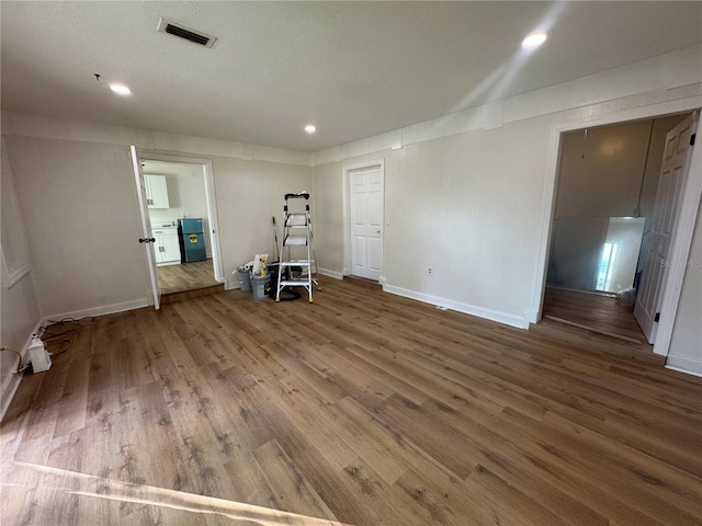 empty room with wood-type flooring