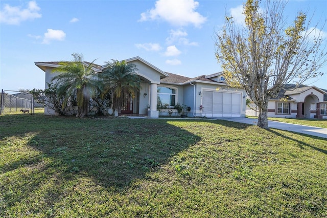 ranch-style home featuring a garage and a front lawn