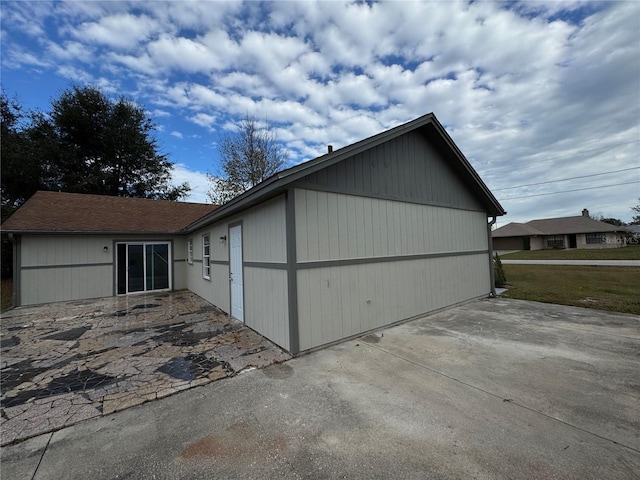 view of side of property with a yard