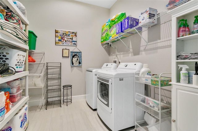 laundry area with washing machine and dryer