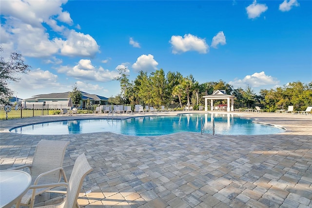 view of swimming pool featuring a patio area