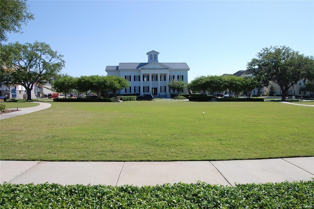view of home's community featuring a lawn