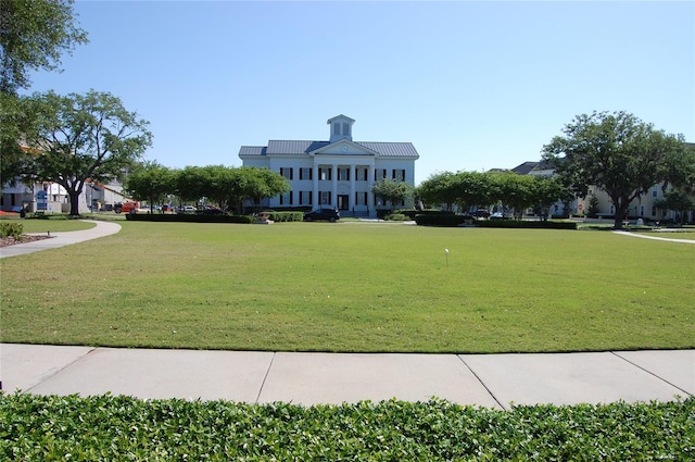 view of community featuring a yard