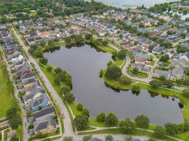 drone / aerial view featuring a water view and a residential view