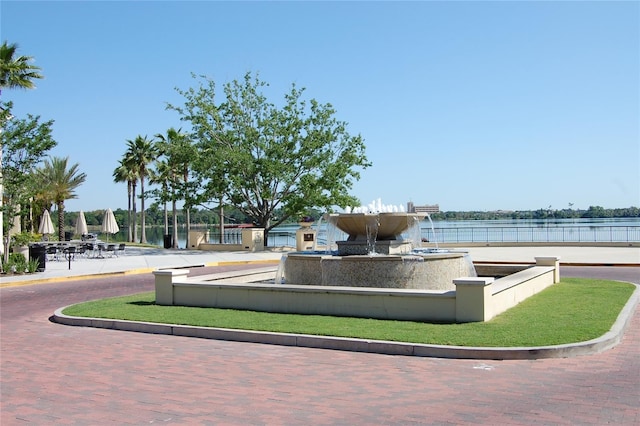 surrounding community featuring a water view
