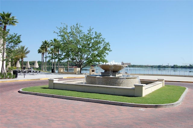 view of community with a water view