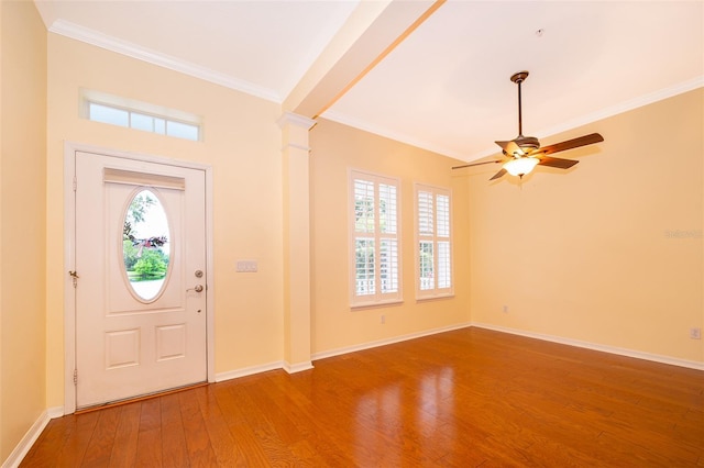 entryway with crown molding, baseboards, a ceiling fan, and wood finished floors