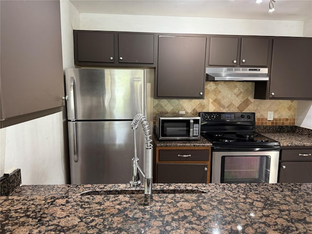 kitchen with dark brown cabinets and appliances with stainless steel finishes