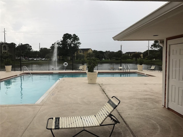 view of swimming pool with a patio area