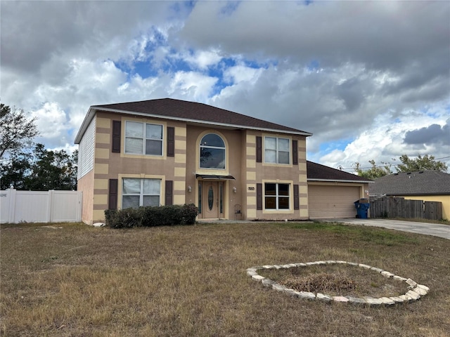 view of front of house with a garage and a front yard