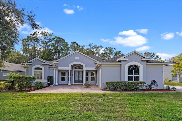 single story home featuring a front yard