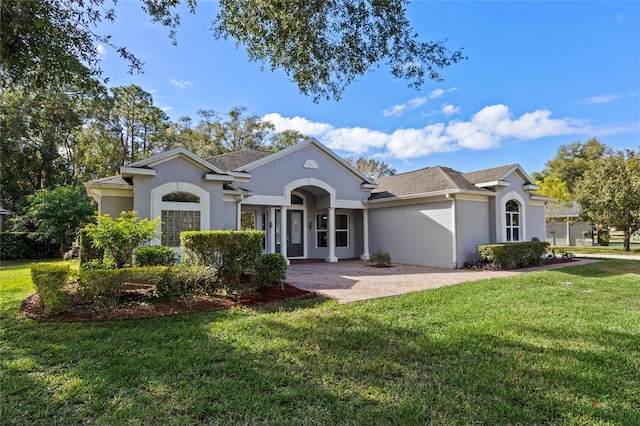 ranch-style house with a front lawn