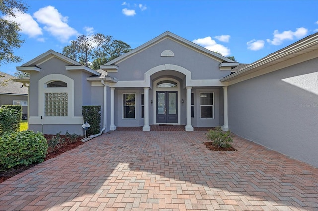 entrance to property featuring french doors