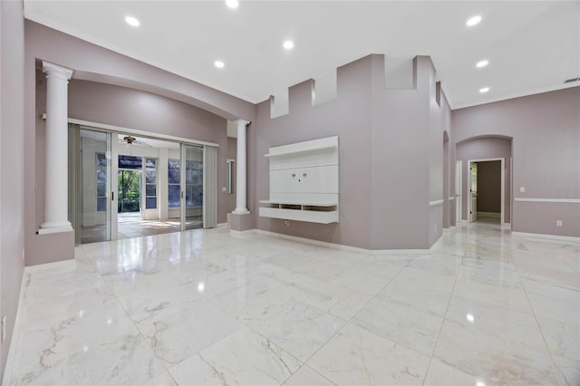 unfurnished living room with french doors and ceiling fan