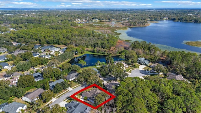 birds eye view of property featuring a water view