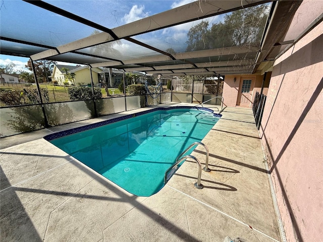 view of pool featuring a patio area and a lanai