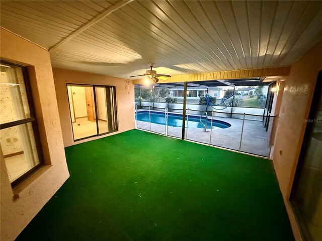 view of pool with ceiling fan