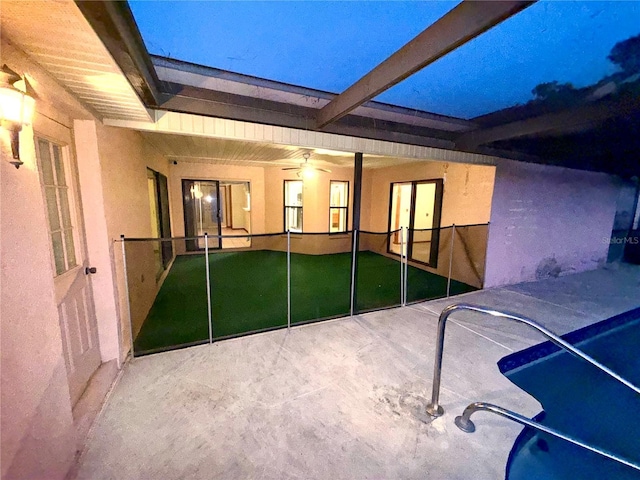 view of swimming pool with a patio area and ceiling fan