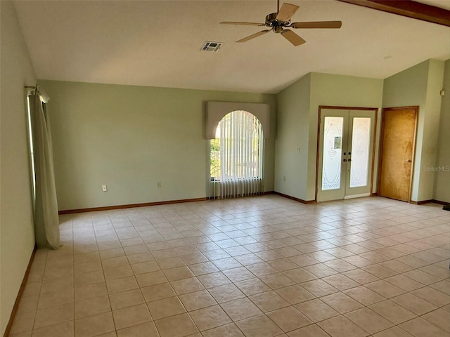 tiled empty room featuring french doors, lofted ceiling with beams, and ceiling fan