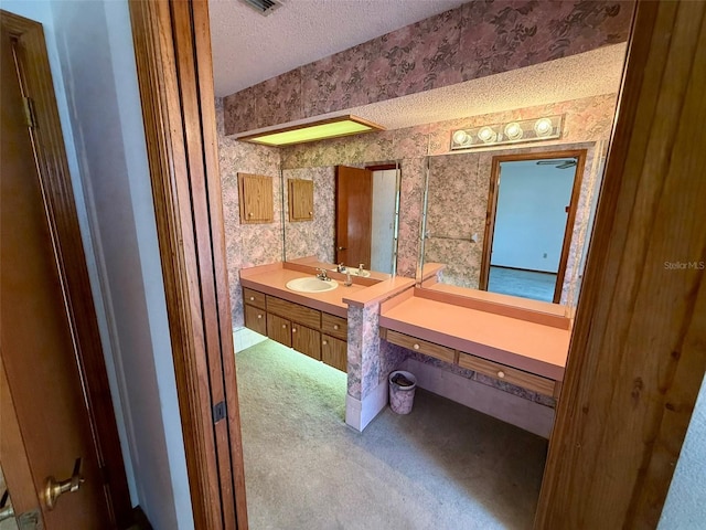 bathroom featuring vanity and a textured ceiling