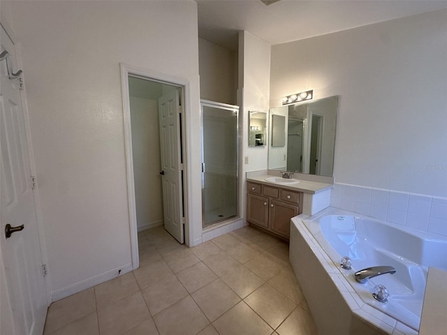 bathroom with tile patterned flooring, vanity, and shower with separate bathtub