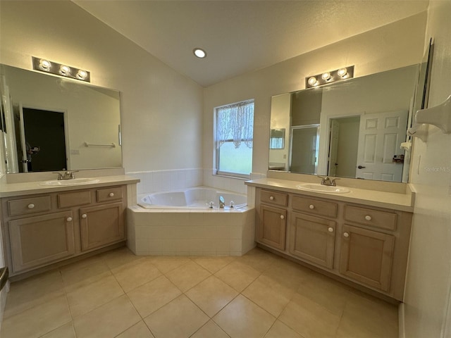 bathroom with separate shower and tub, tile patterned floors, vanity, and lofted ceiling